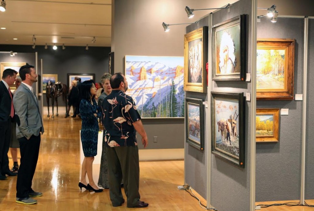 DSU Sears Dixie Invitational: Attendees of the 2015 annual Robert N. and Peggy Sears Dixie Invitational Art Show and Sale peruse the art on display in the Sears Art Museum Gallery. This year’s gala is set to take place on Friday, Feb. 12, in the gallery, which is located on the Dixie State University campus.