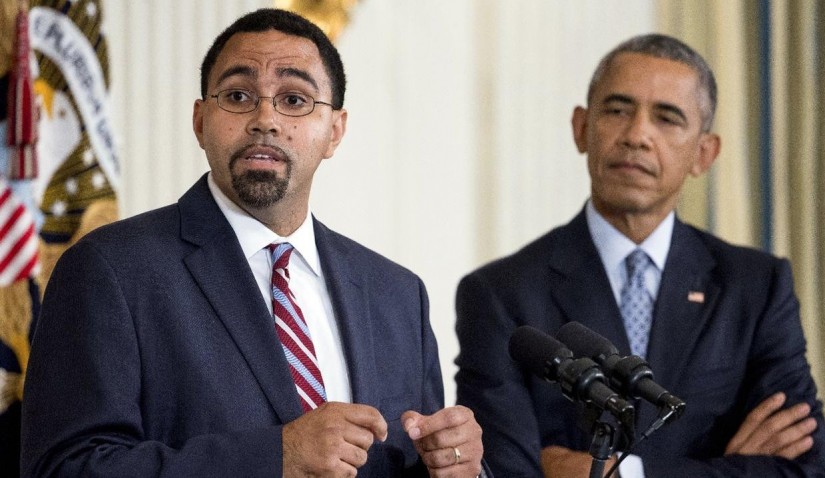 Senior Education Department official, John King Jr., left, accompanied by President Barack Obama, speaks in the State Dining Room of the White House in Washington, Friday, Oct. 2. YouTube Image