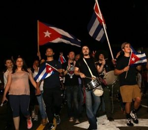 The death of Fidel Castro, Cuba's longtime communist dictator, is celebrated by the Cuban population of Miami as they gather in Little Havana on 8th Street. (Photo: Jeff Binion/Newscom)